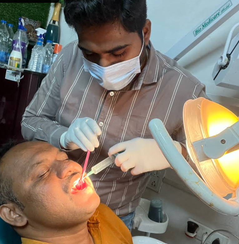 Doctor treating patient at Minakshi Dental Clinic